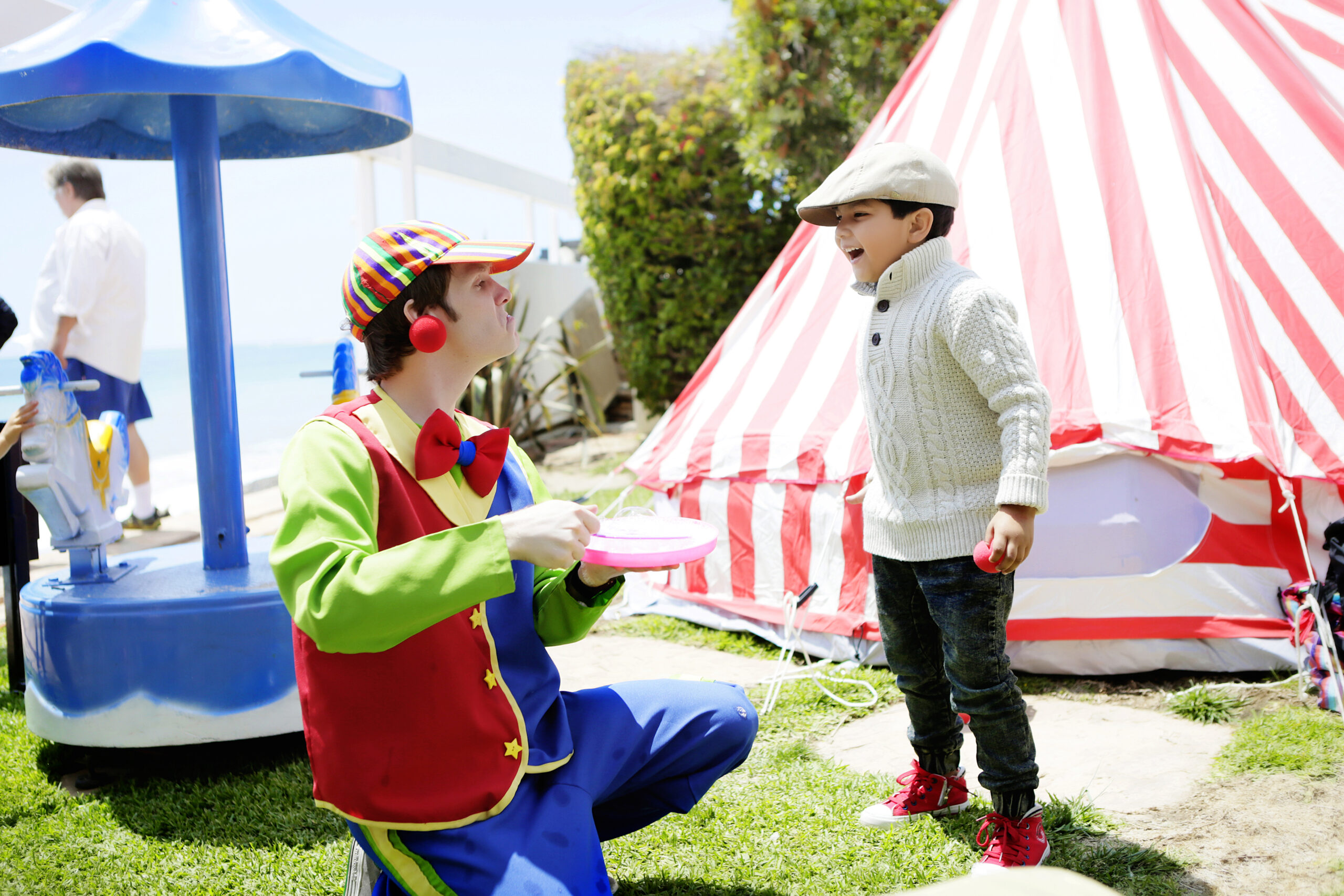 A child plays with a Send in the Clowns Party Character
